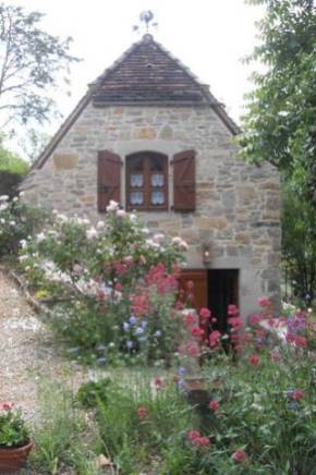 The gites at Sauliac-sur-Cele, Lot, France, with summer flowers